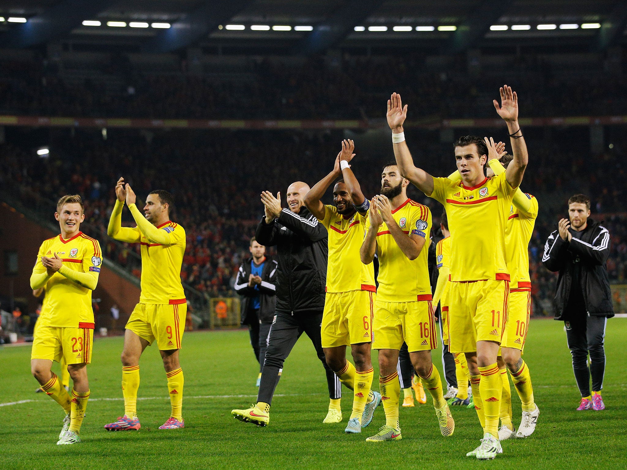 The Wales team celebrate after the final whistle