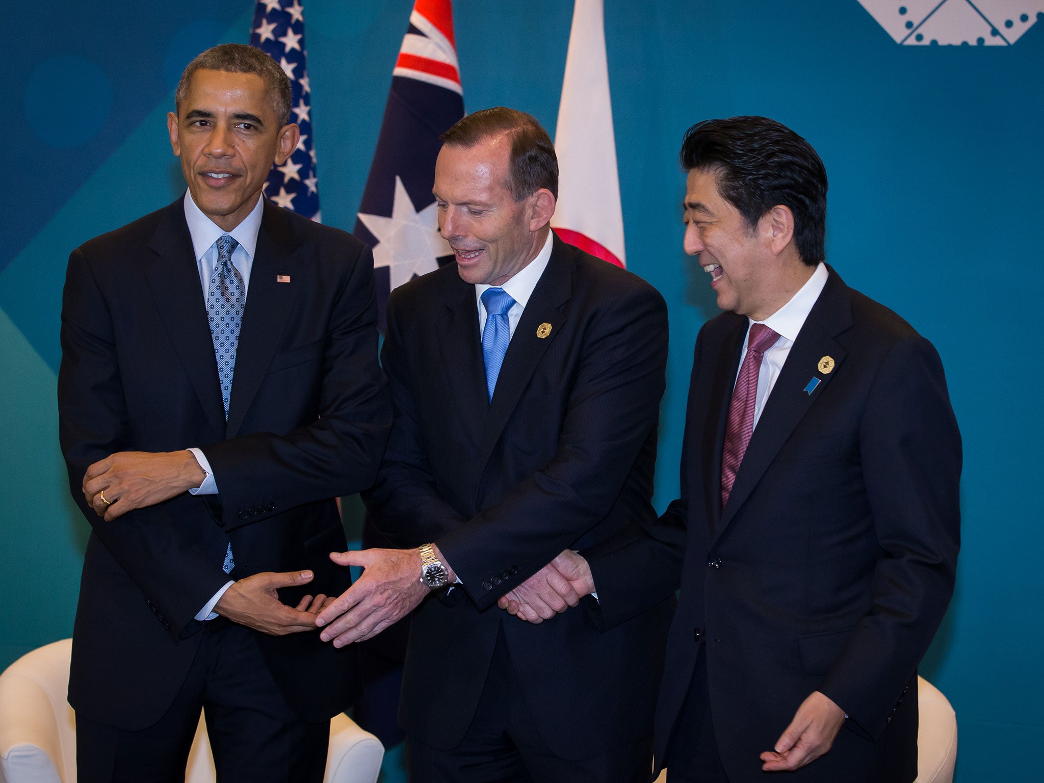President Barack Obama, Australian Prime Minister Tony Abbott, and Japan's Prime Minister Shinzo Abe meet during a trilateral meeting at the G20 Summit