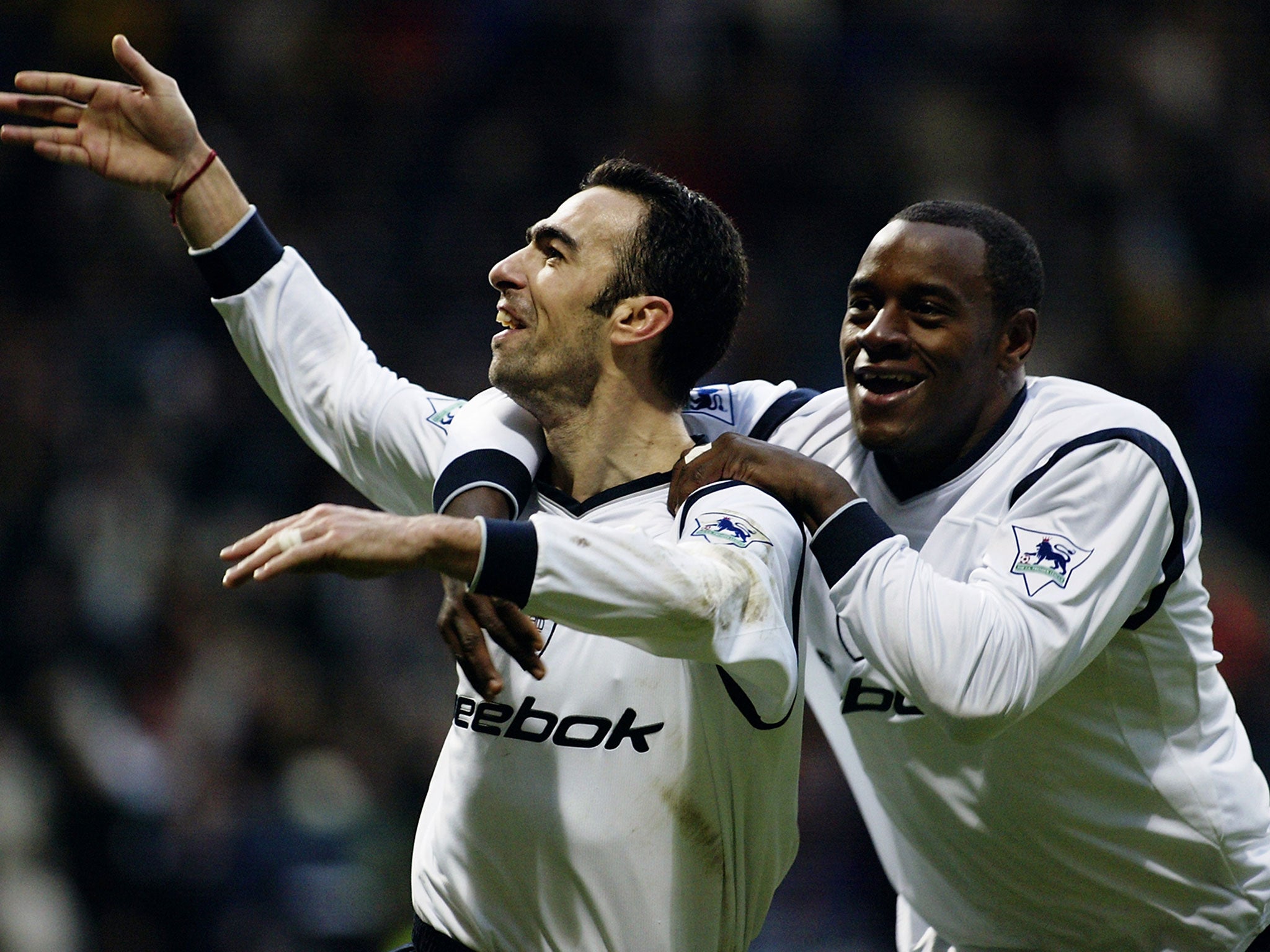 Facey celebrates with Youri Djorkaeff during a match for Bolton in 2003