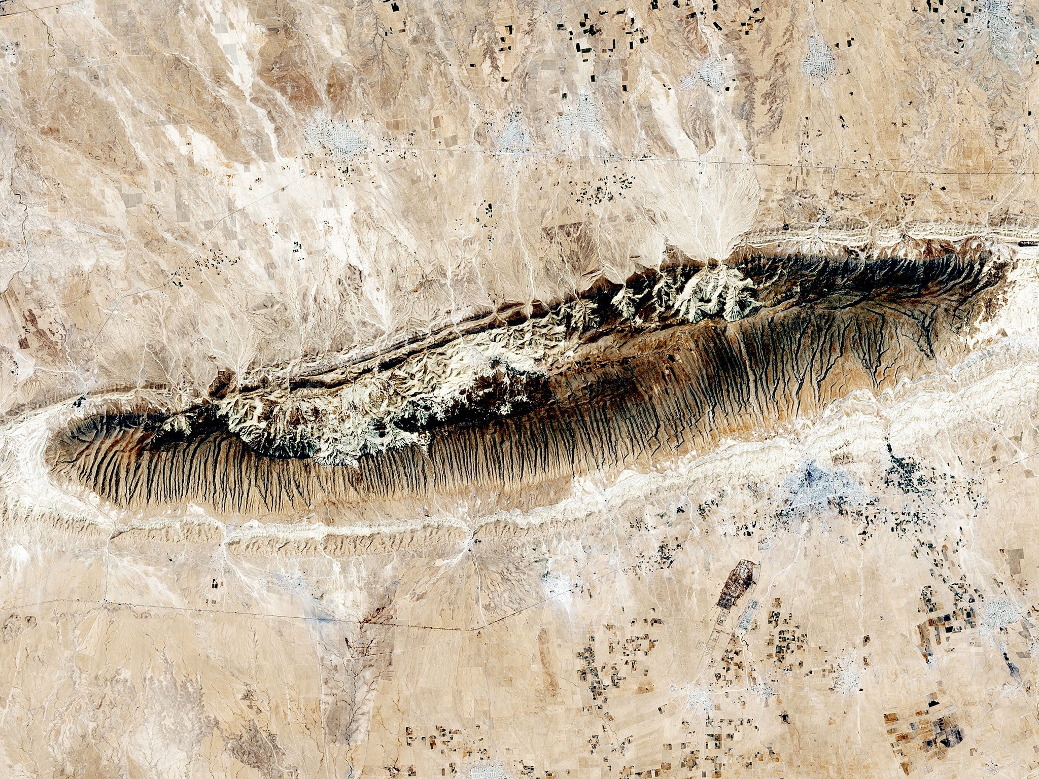 A satellite image of Mount Sinjar in Iraq, the holy mountain to Yazidis. Around 6,000 remain there, surrounded by Isis