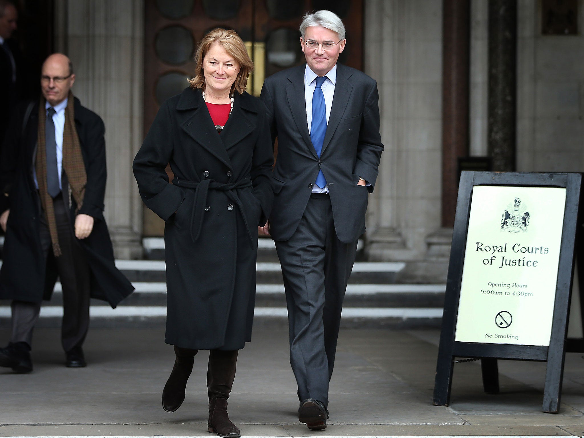 The former Chief Whip Andrew Mitchell leaves the High Court with his wife, Sharon