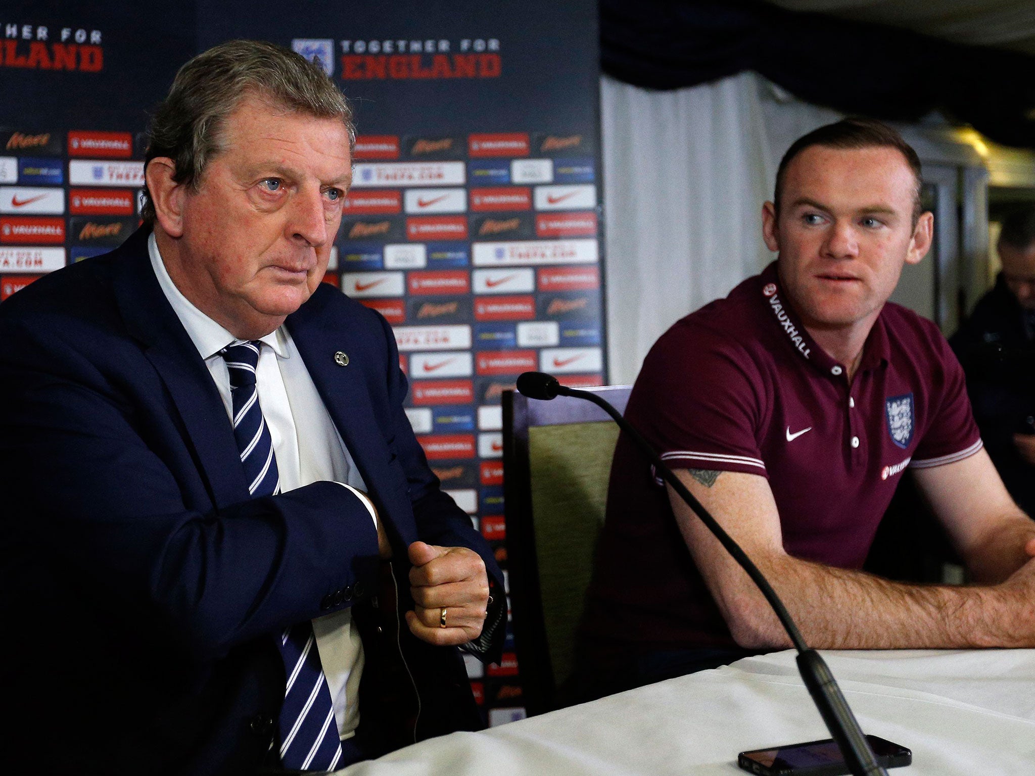The England manager, Roy Hodgson, left, and his captain, Wayne Rooney, address the press