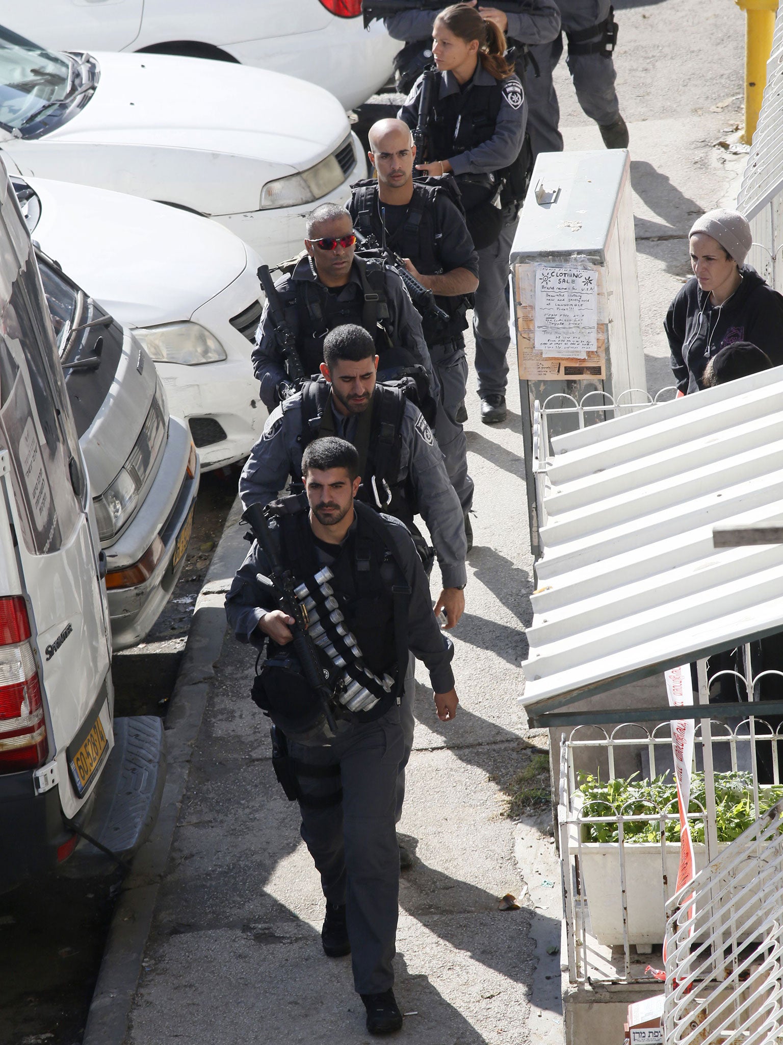 Israeli security forces secure the scene, after two Palestinians attacked a synagogue in the ultra-Orthodox Har Nof neighbourhood in Jerusalem
