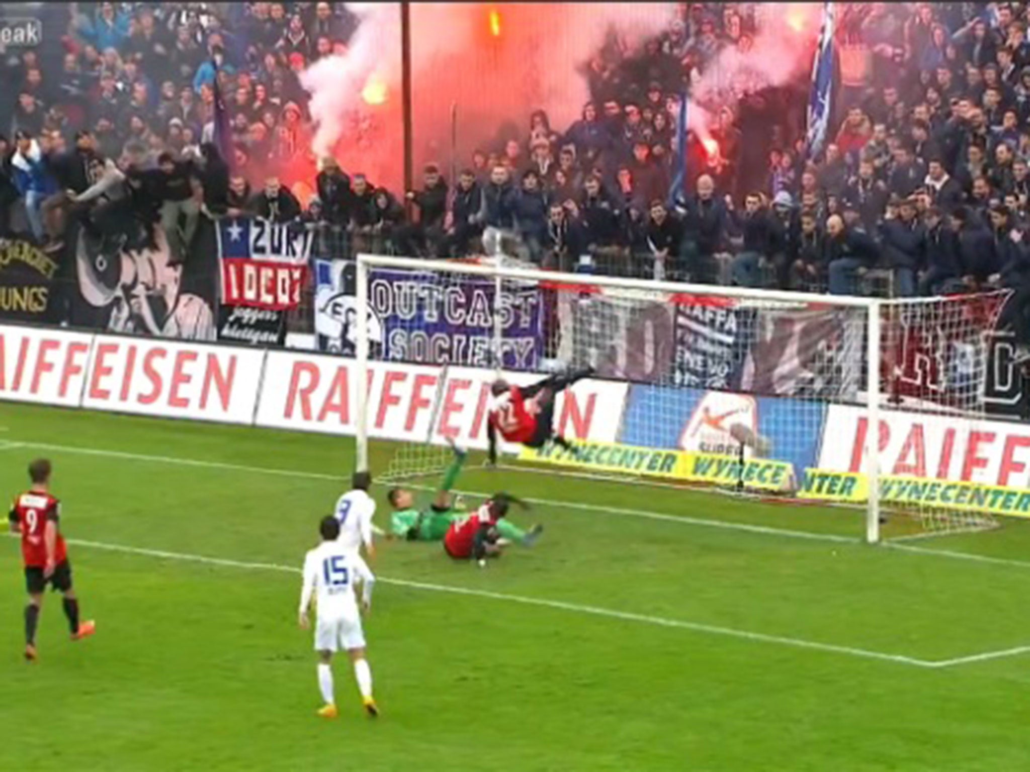 FC Aarau goalkeeper Joel Mall and defender Igor N'Ganga keep out FC Zurich's Mohamed Chermiti's penalty attempt