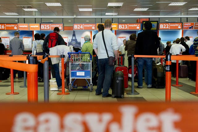 Passengers queue up at the Easyjet counter at Berlin's Schoenefeld airport.