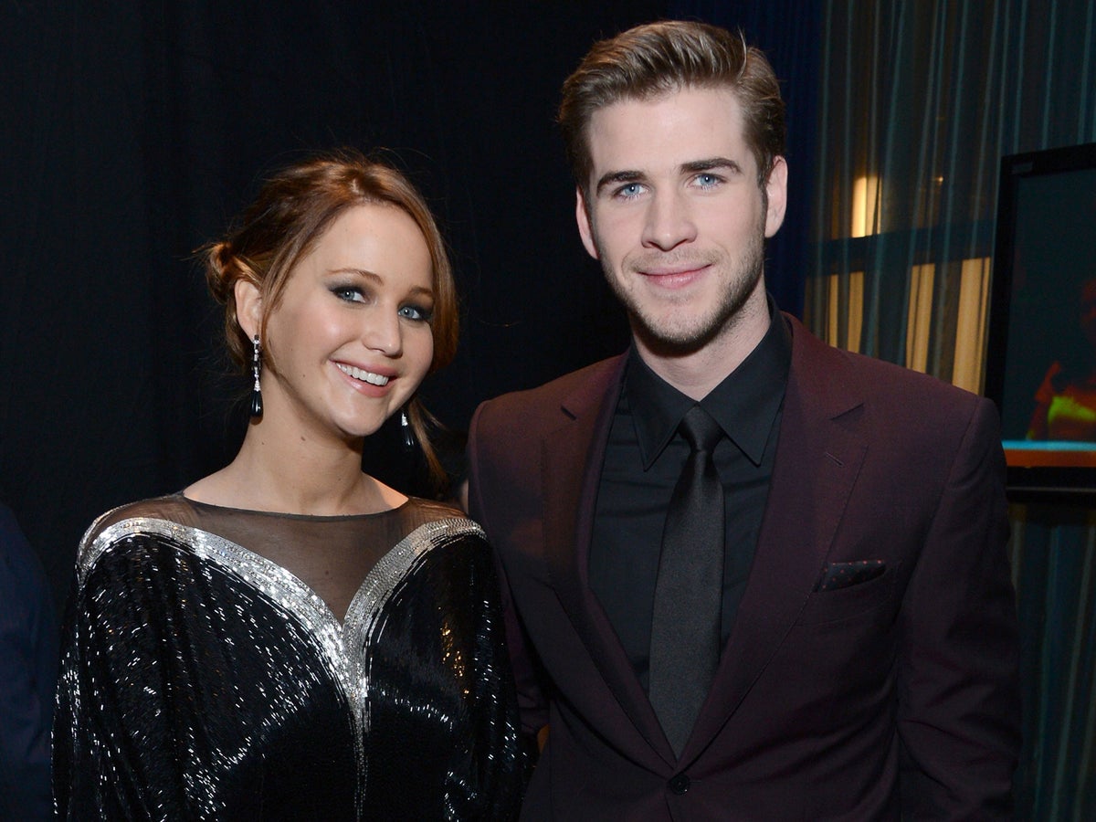 The World Of The Hunger Games  Jennifer Lawrence, Liam Hemsworth