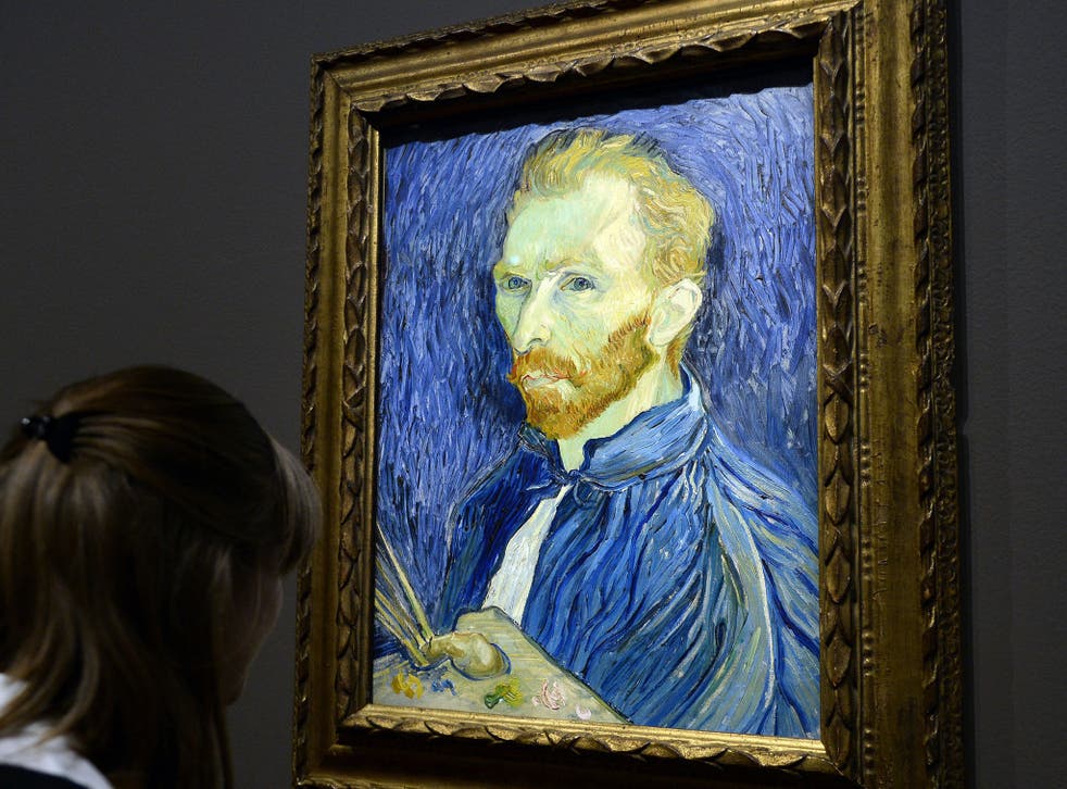 A visitor looks at a self-portrait by Vincent Van Gogh displayed at the Orsay Museum as part of the exhibition 'Van Gogh/Artaud. The Man Suicided by Society', on 10 March, 2014, in Paris
