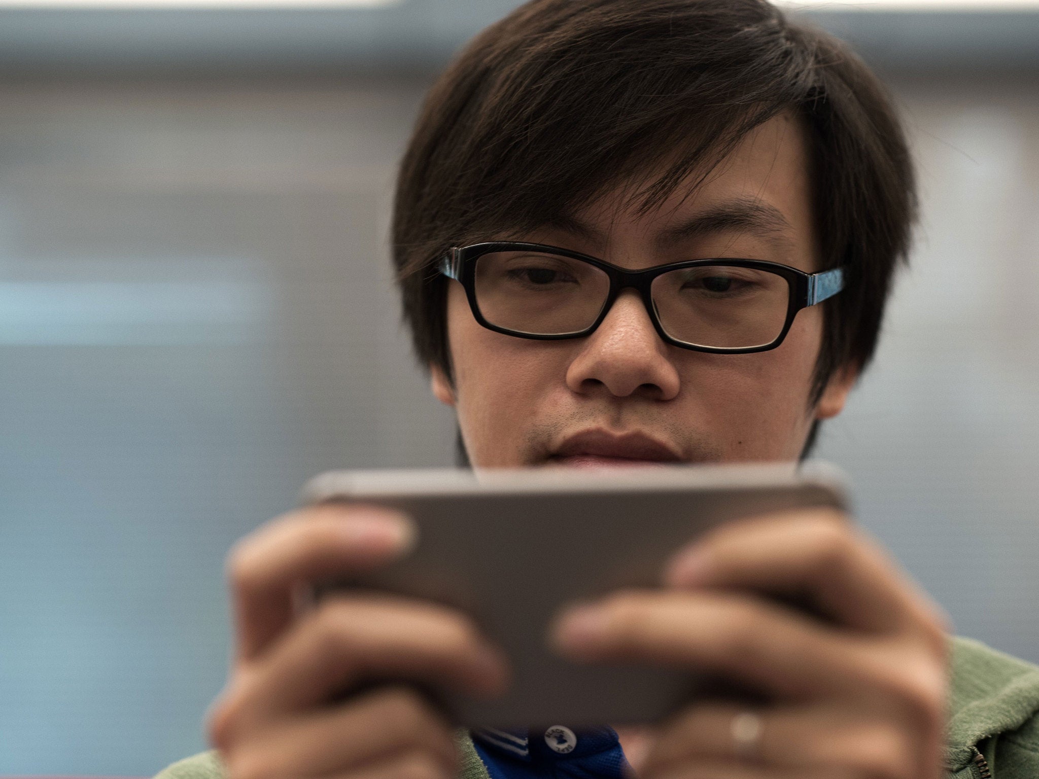 The app keeps people from using their phone by growing apples while they keep them together