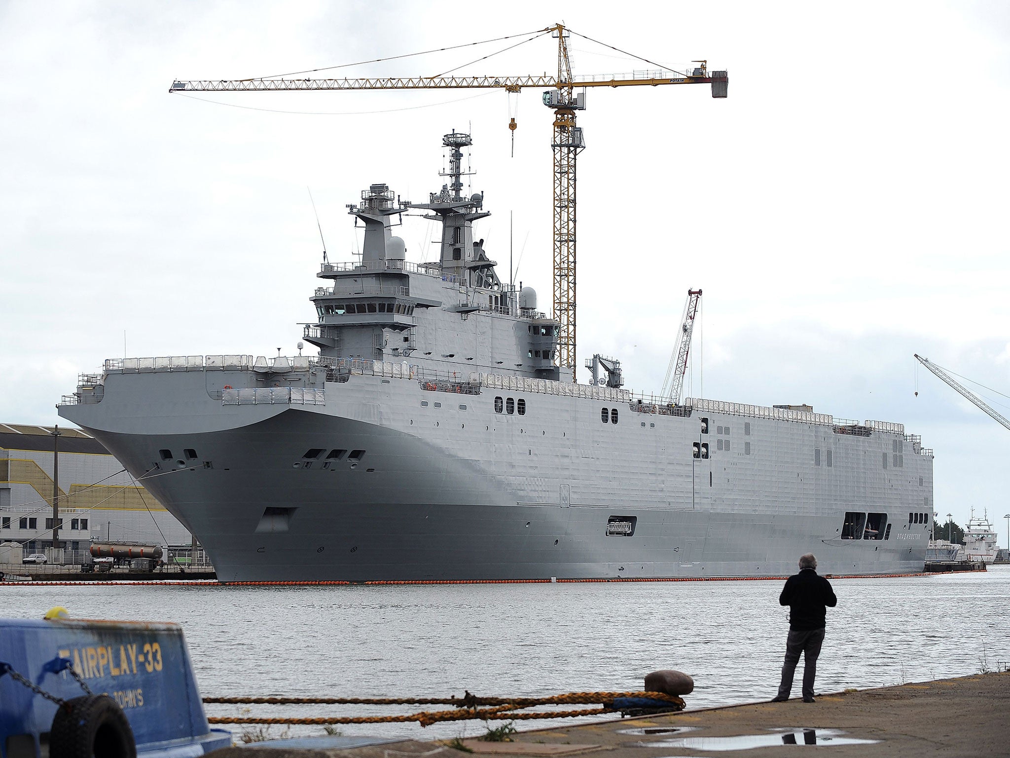 File image taken on 9 May, 2014 in Saint-Nazaire shows the Vladivostok warship, a Mistral class helicopter carrier ordered by Russia