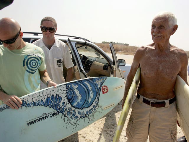 Paskowitz, right, at the Erez Crossing in 2007 with his gift of 15 surfboards; he believed surfing could bring Israelis and Palestinians together