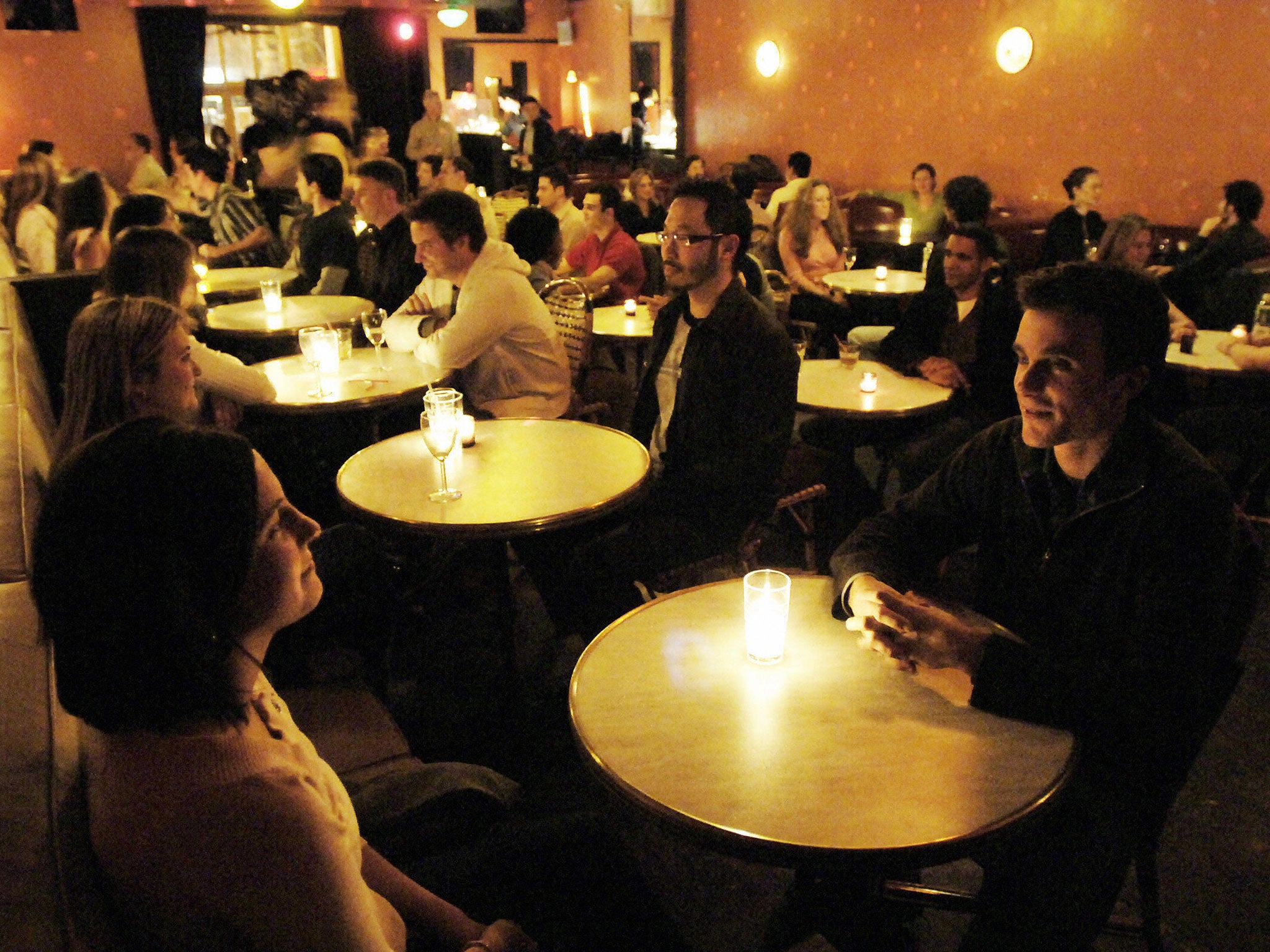 Single people take part in a speed dating event in New York