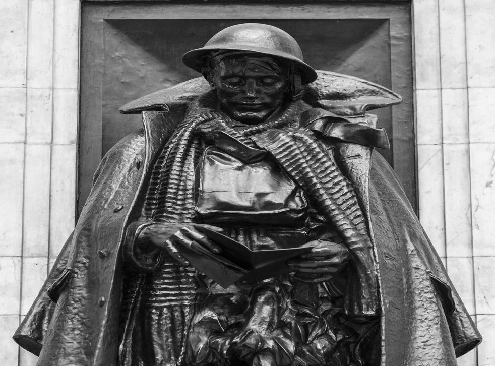 The First World War memorial located on Platform One of London Paddington Station of an unknown soldier reading a letter which commemorates the 3312 employees of the Great Western Railway who lost their lives in the Great War