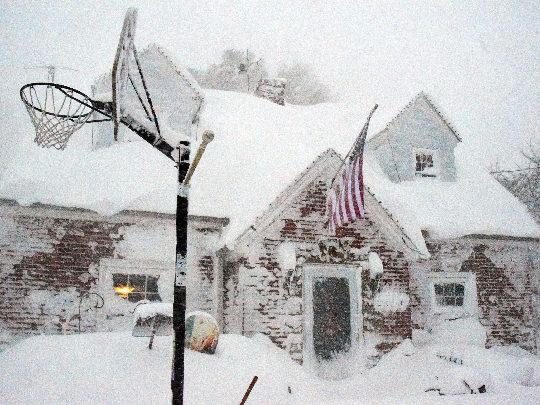 A home is covered in snow in a neighborhood just south of Buffalo, New York