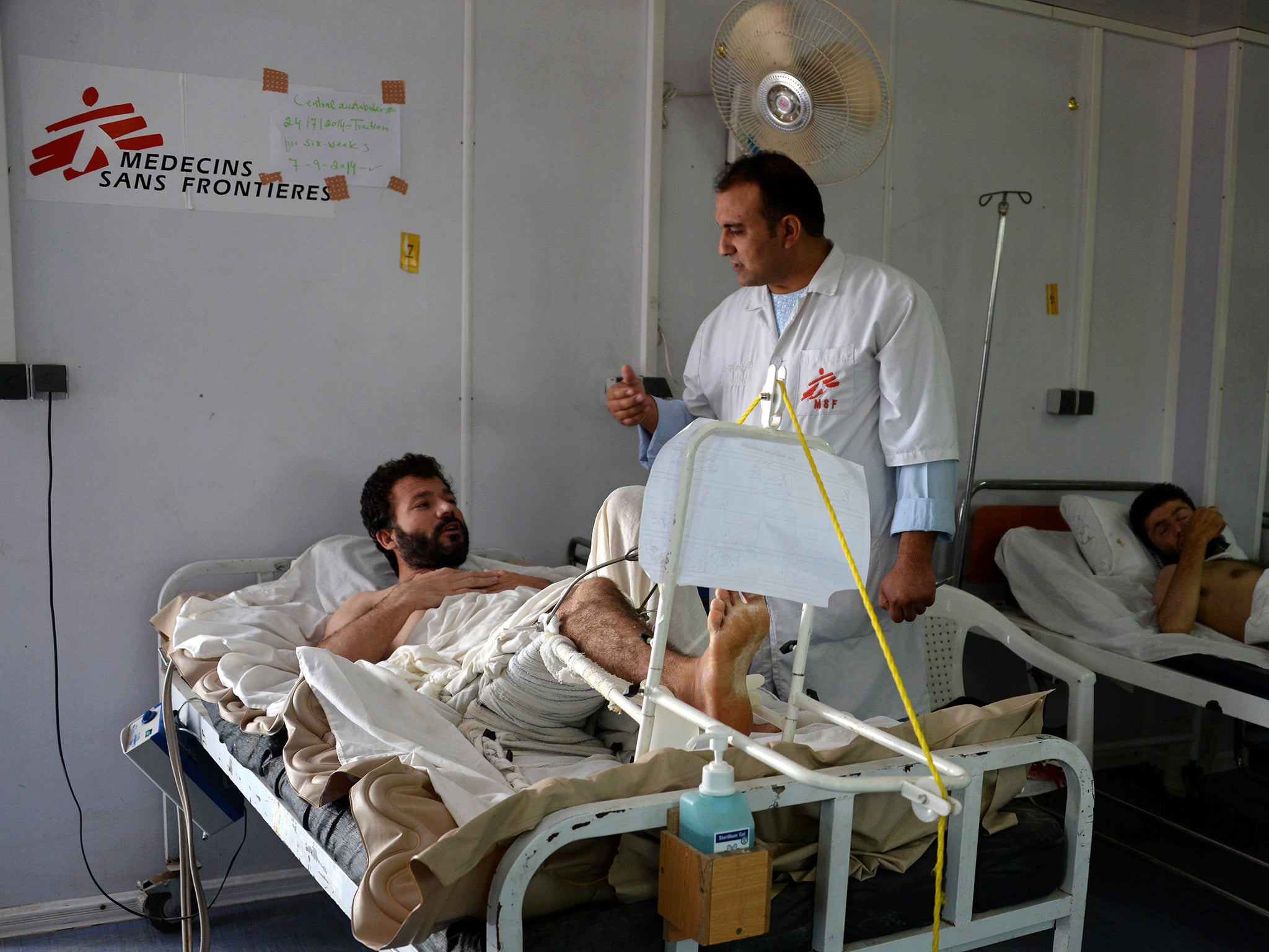 Dr. Safi Seddiqi visits an Afghan patient at the Doctors Without Borders (MSF) trauma centre in Kunduz