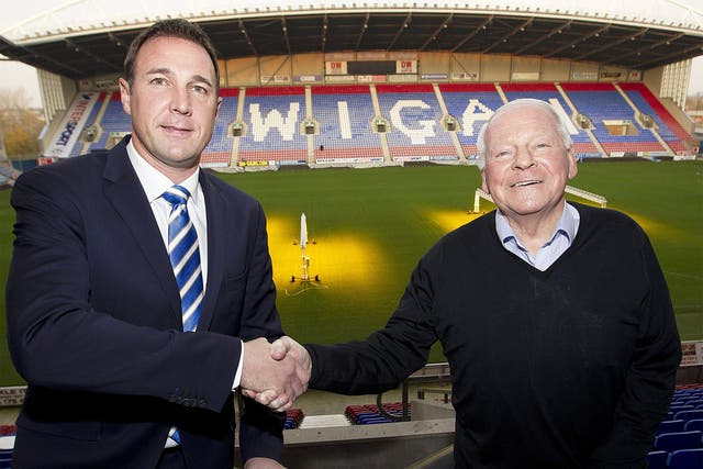Malky Mackay (left) and Dave Whelan shake hands at the DW Stadium