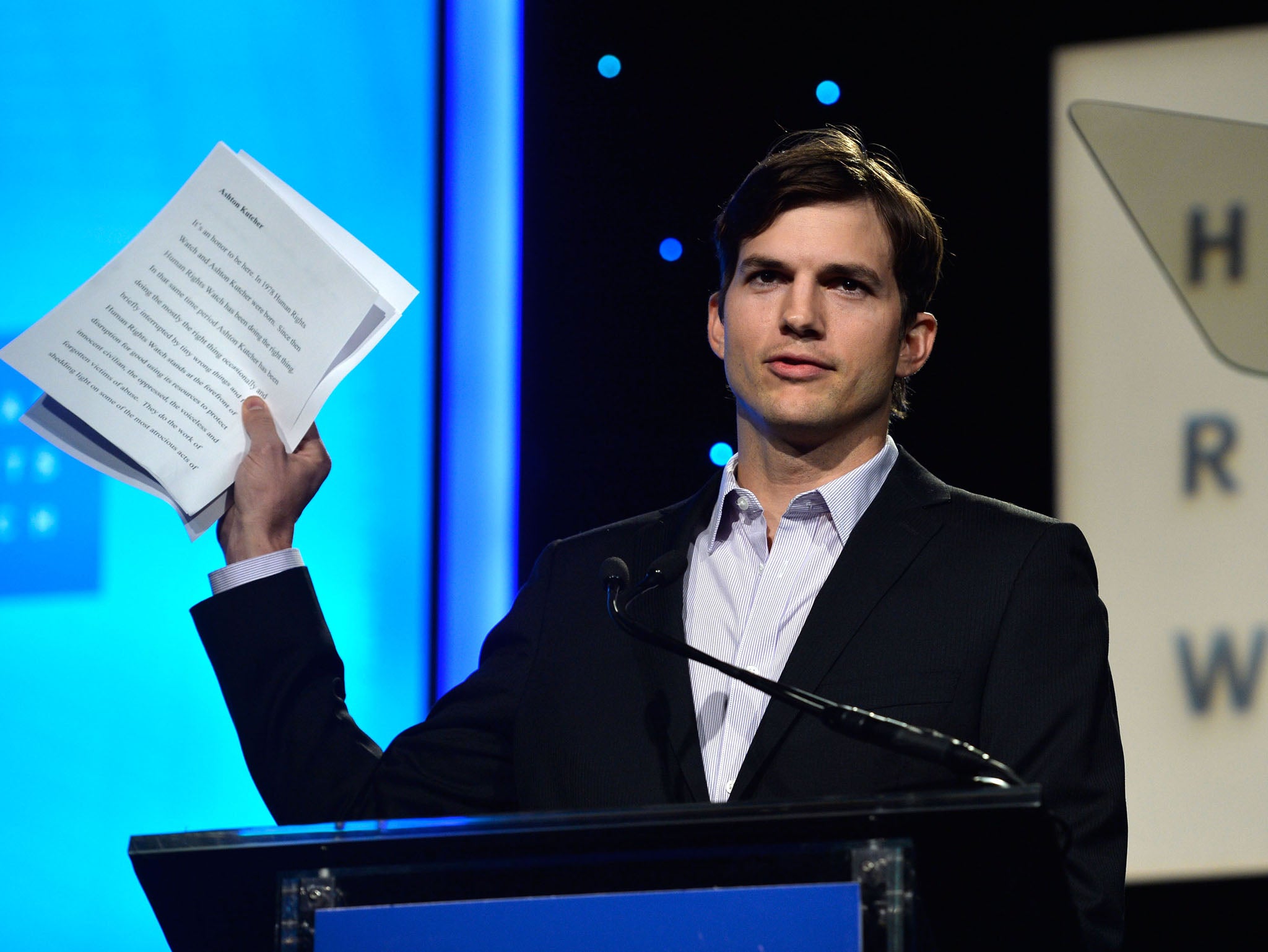 Ashton Kutcher speaking at Human Rights Watch's Voices For Justice dinner in November 2013
