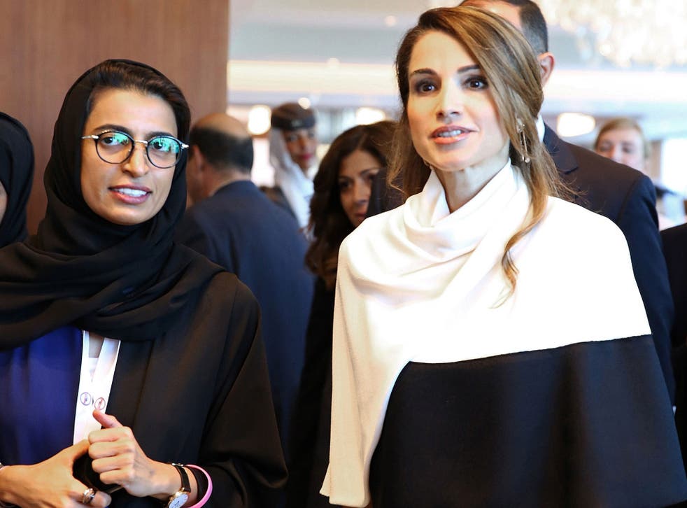 Jordan's Queen Rania (R) walking alongside Twofour54 Chief Executive Officer Noura al-Kaabi, as they arrive for the opening session of the Abu Dhabi Media Summit