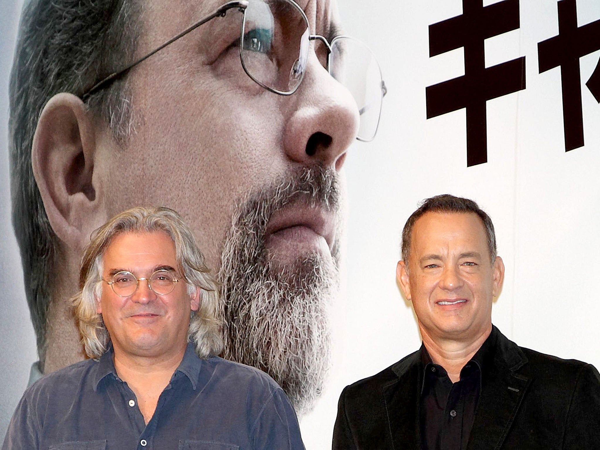 Director Paul Greengrass and leading actor Tom Hanks at the Captain Phillips press conference in Tokyo in 2013