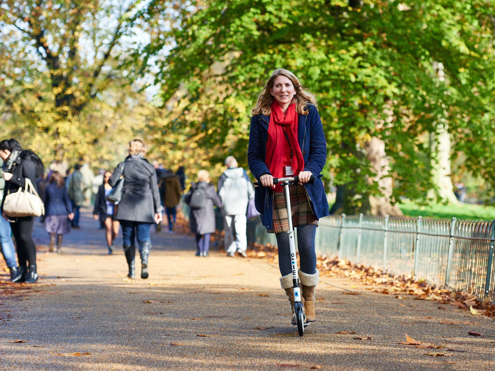 Jane Merrick rides on a Micro Scooter through St James's Park, on November 18, 2014 in London, United Kingdom.