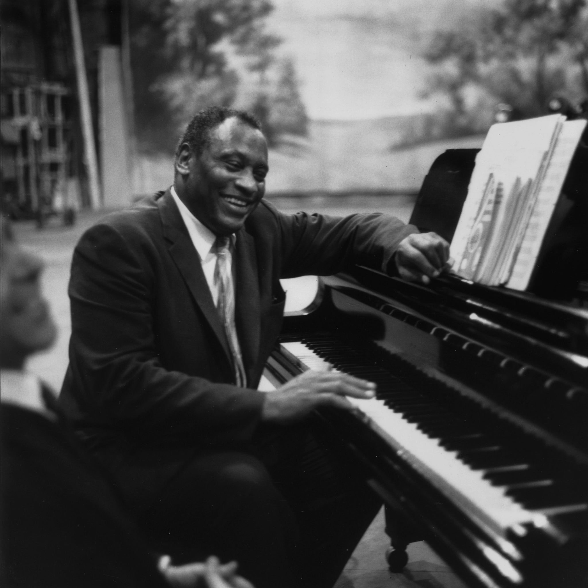 American singer, acclaimed actor of stage and screen, political activist and civil rights campaigner Paul Robeson (1898 - 1976), rehearses in relaxed mood at the piano.