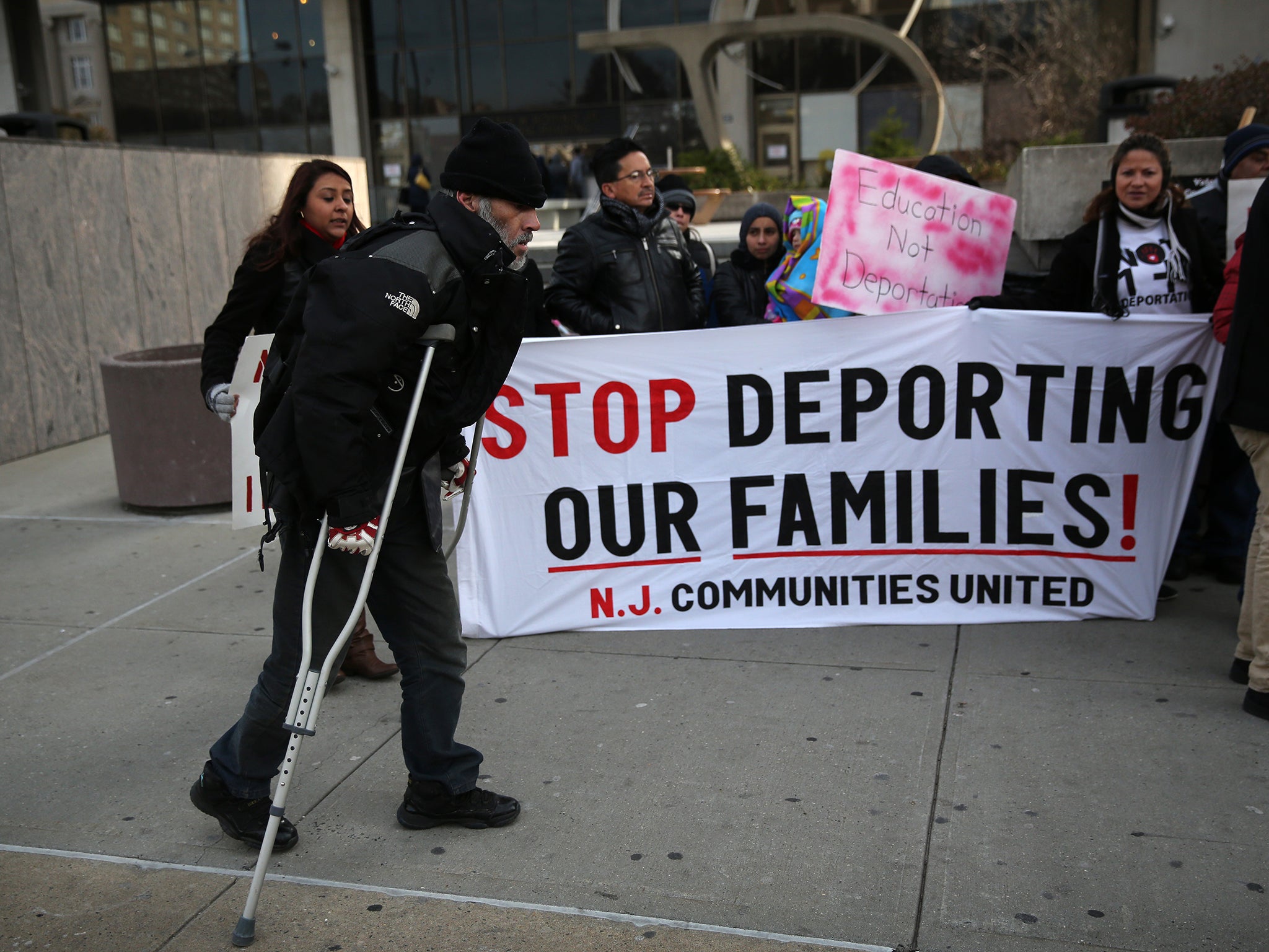 Immigrants attend a press conference for families facing deportation