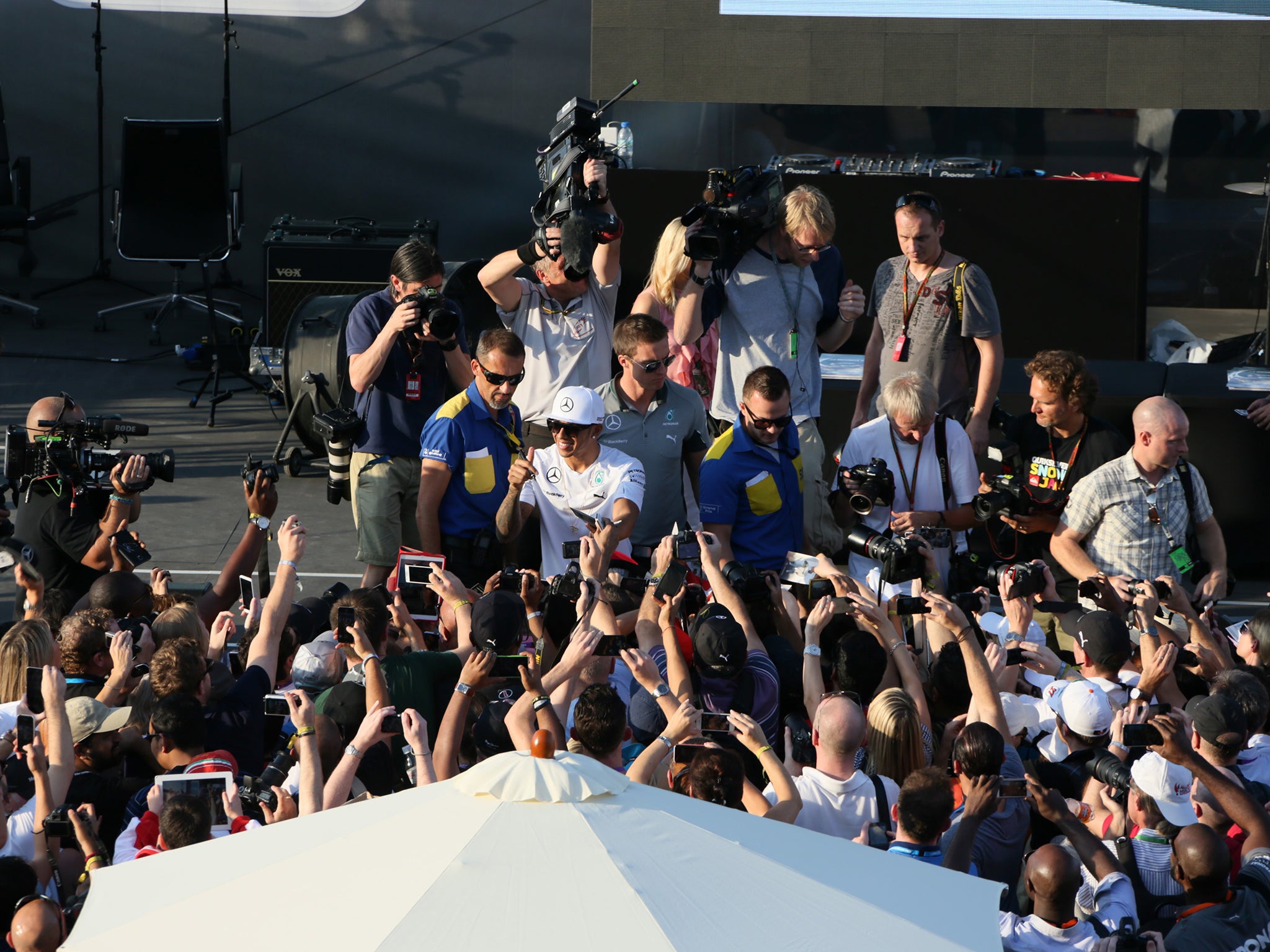 Lewis Hamilton greets fans at the Yas Marina Circuit in Abu Dhabi yesterday