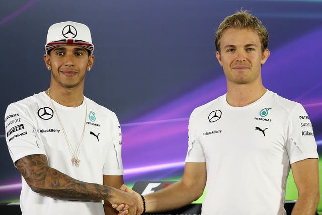 Lewis Hamilton and Nico Rosberg shake hands ahead of the Abu Dhabi Grand Prix