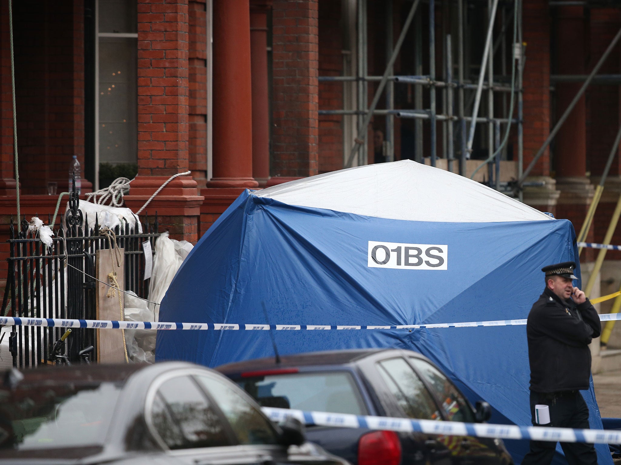 A police forensics tent thought to cover the body of one of the men killed in Cadogan Square