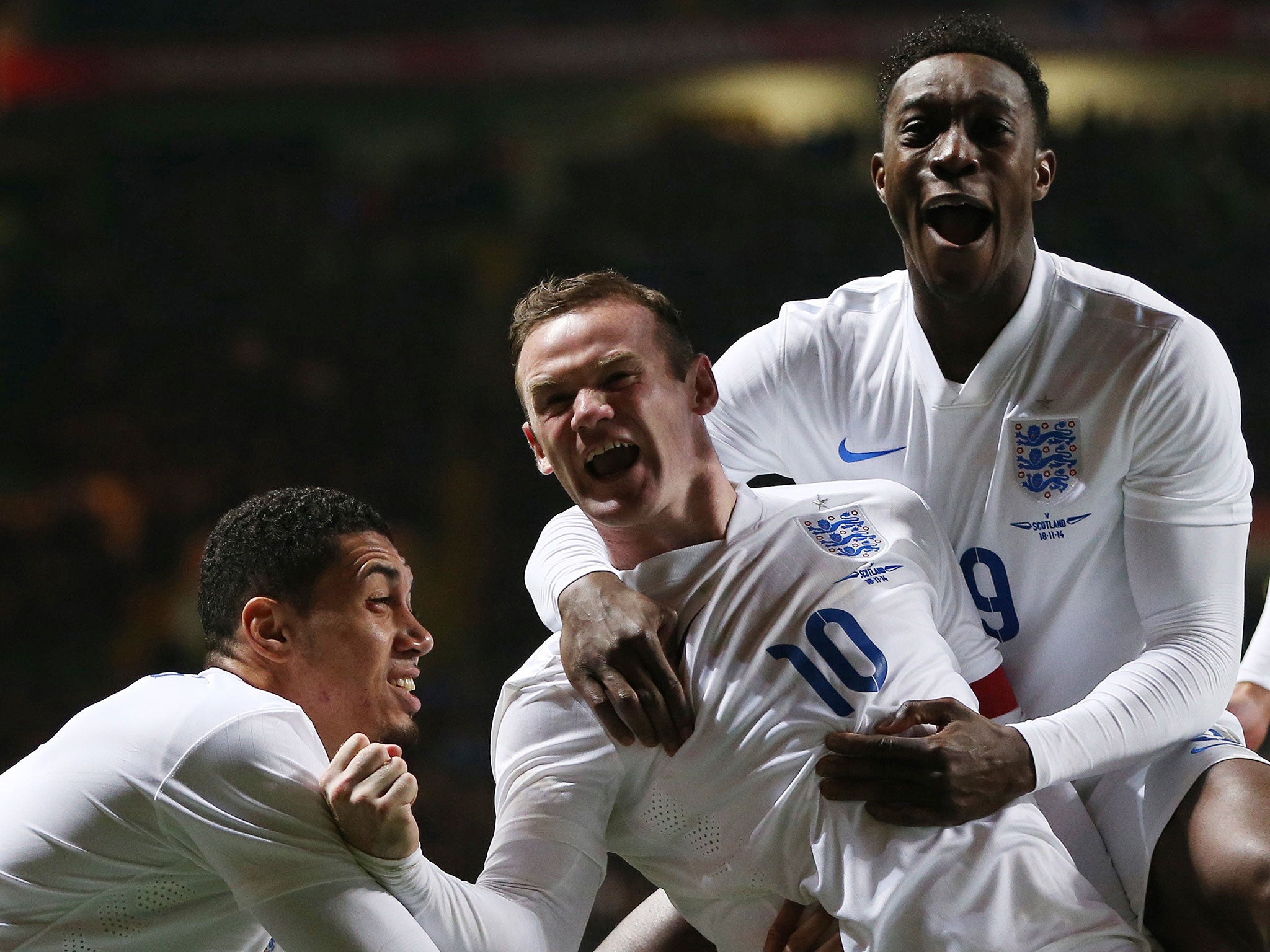 Chris Smalling, Wayne Rooney and Danny Welbeck celebrate for England in midweek