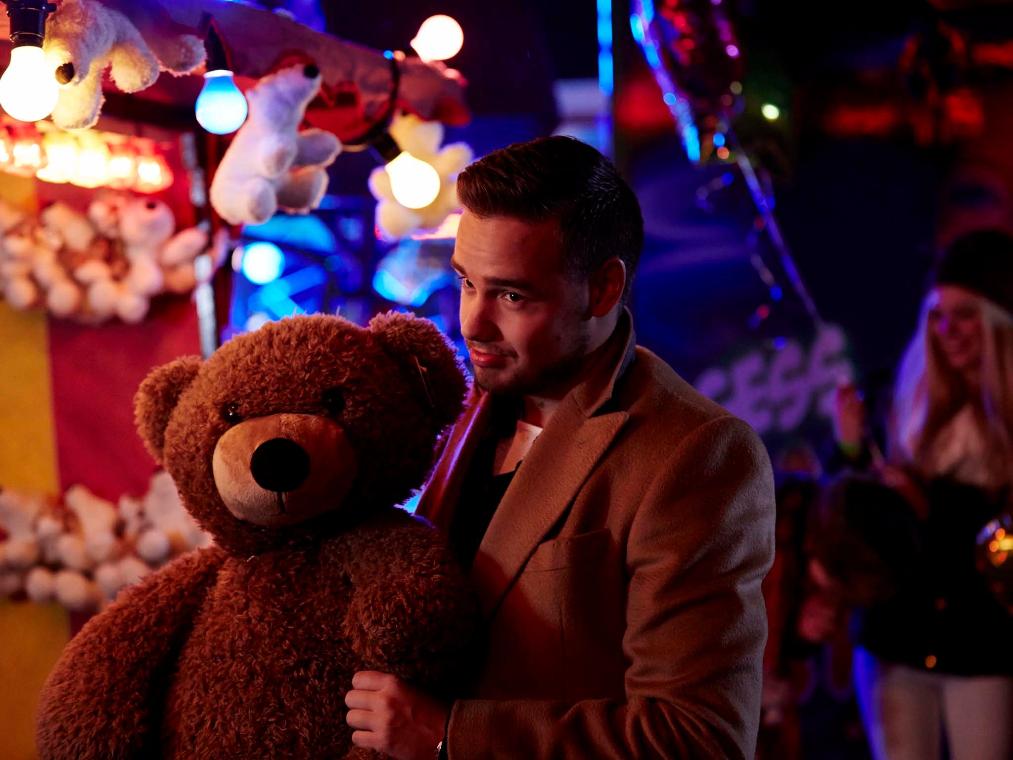 One Direction's Liam Payne romances a mystery lover with a giant teddy bear in the 'Night Changes' music video