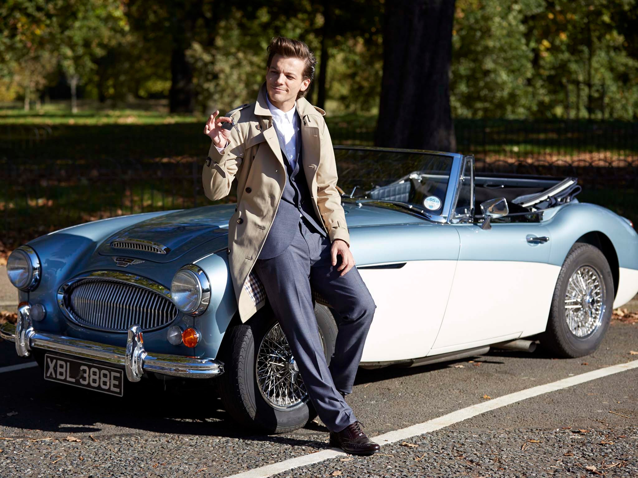 One Direction's Louis Tomlinson flashes the keys to a classic car in the 'Night Changes' video