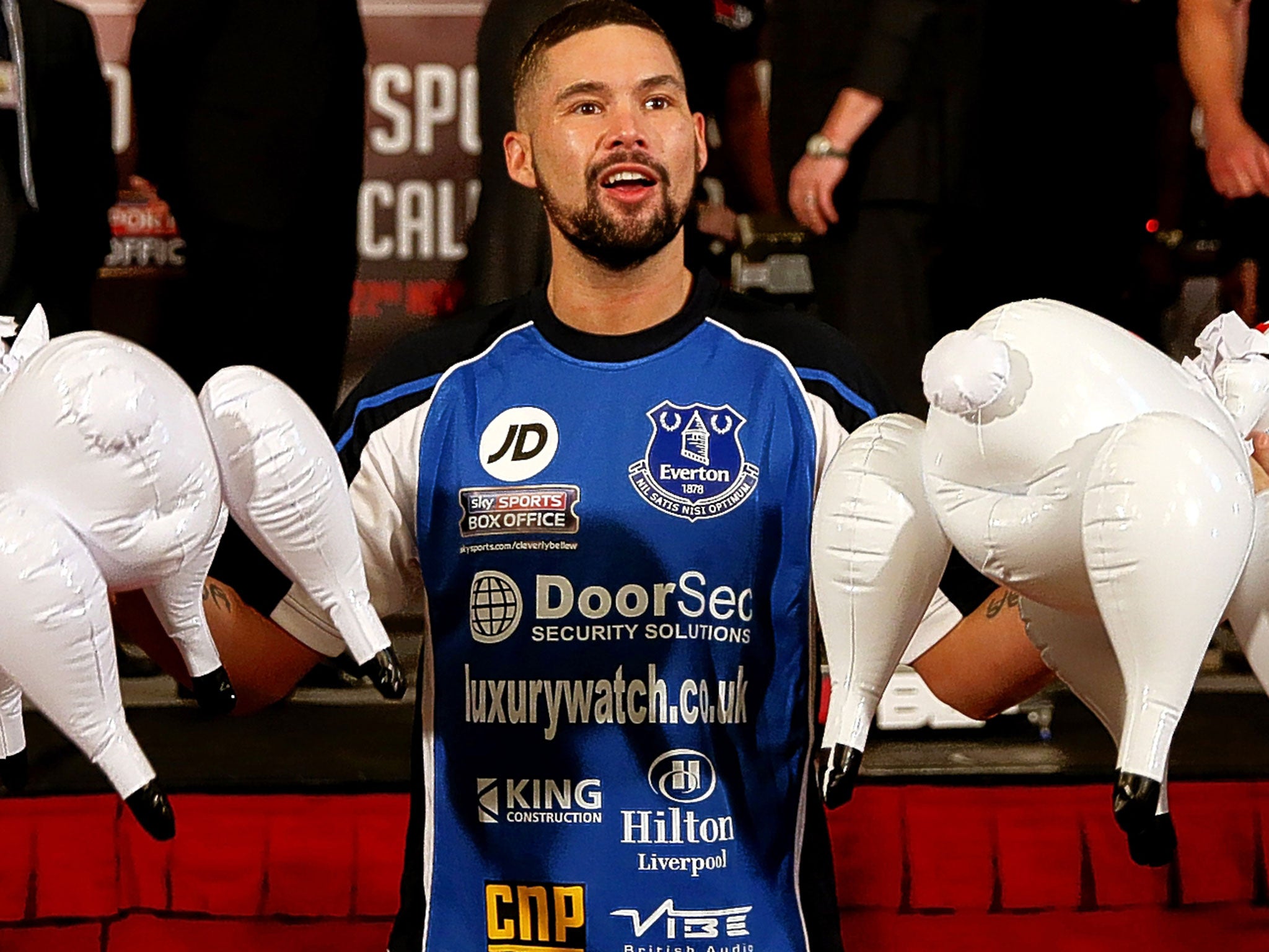 Tony Bellew holds two inflatable plastic sheep at the weigh-in for his rematch with Nathan Cleverly