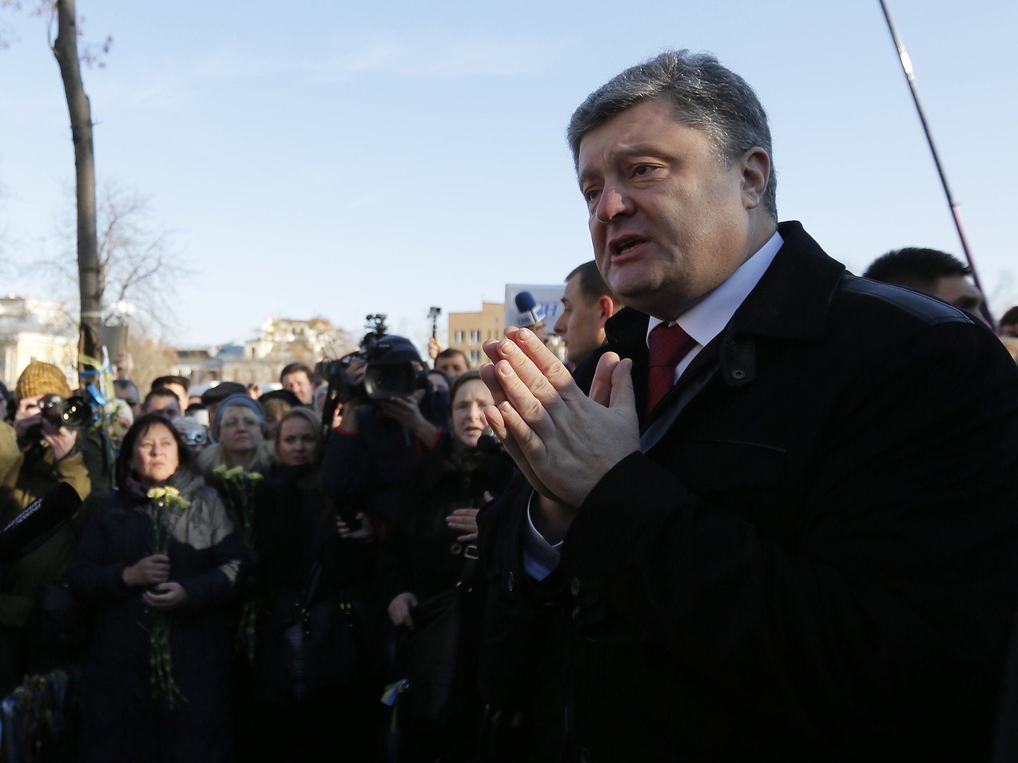 Ukrainian President Petro Poroshenko was shouted down by angry relatives
