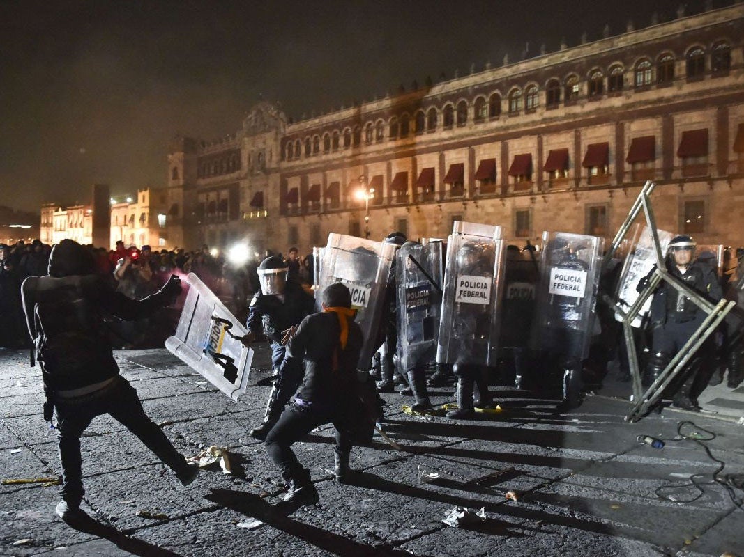 Protesters clash with riot police