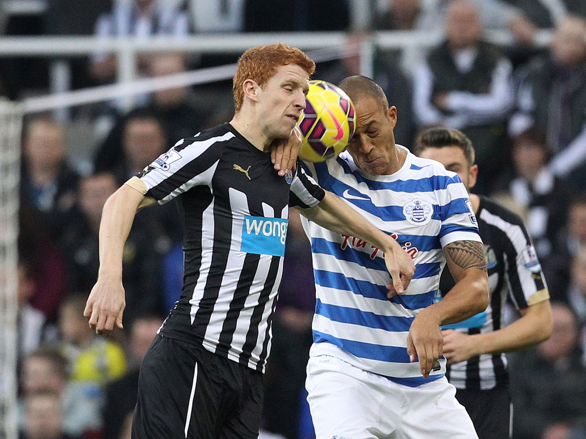 Jack Colback and Bobby Zamora collide as they contest a high ball