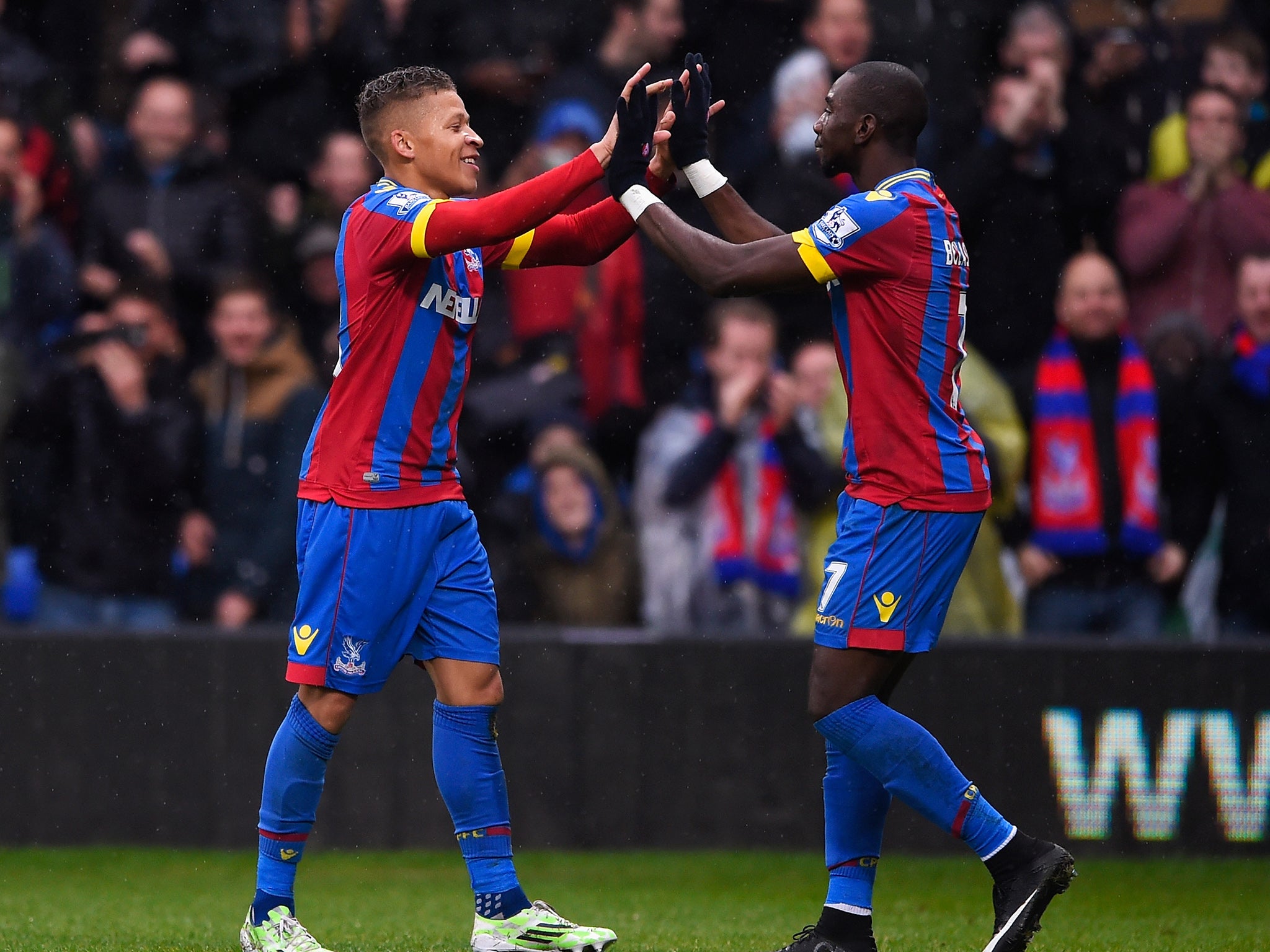 Dwight Gayle celebrates with Yannick Bolasie