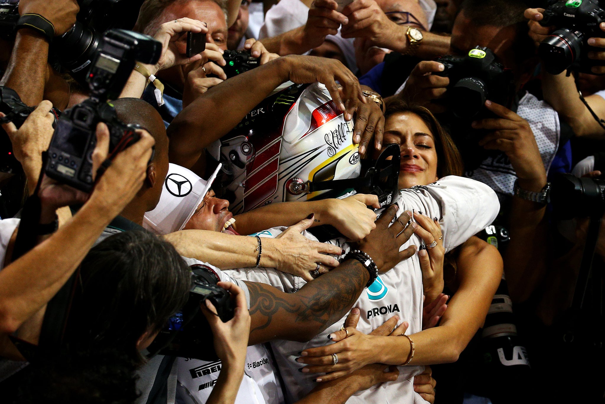 Lewis Hamilton celebrates winning the Abu Dhabi Grand Prix and the 2014 Drivers' Championship