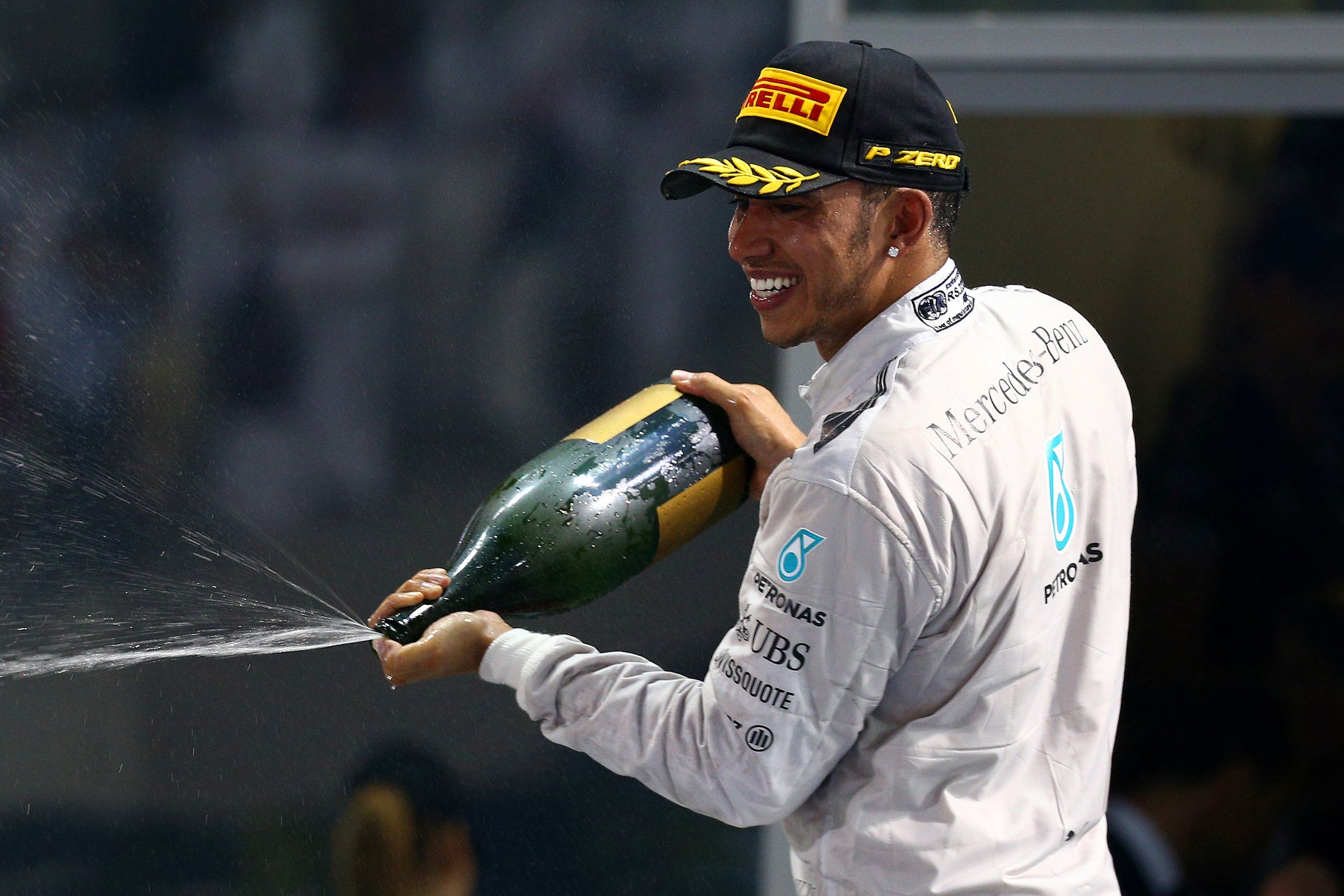 Britain's Hamilton celebrates his triumph in Abu Dhabi