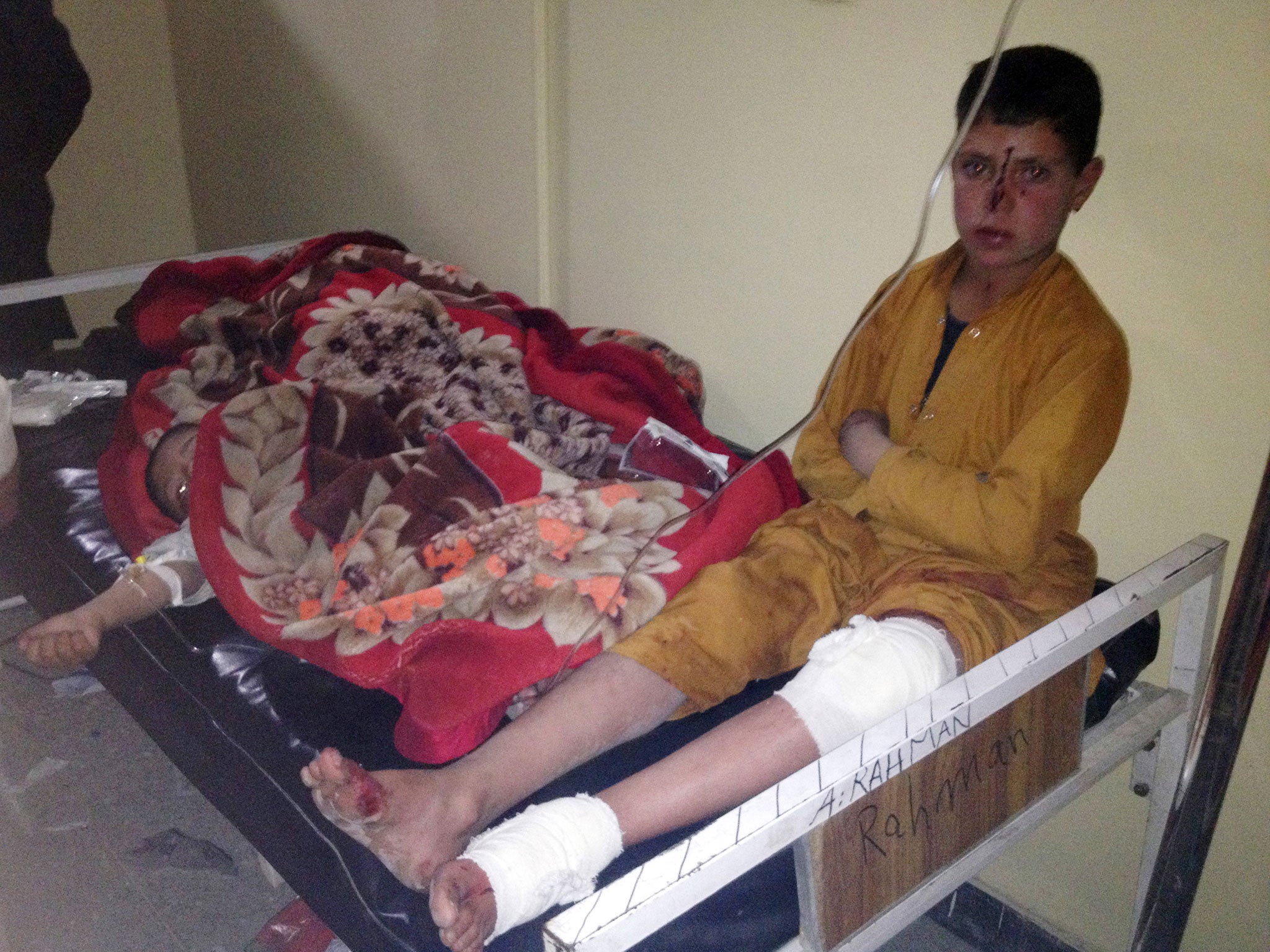 Afghan children are treated at Paktika hospital after the suicide attack