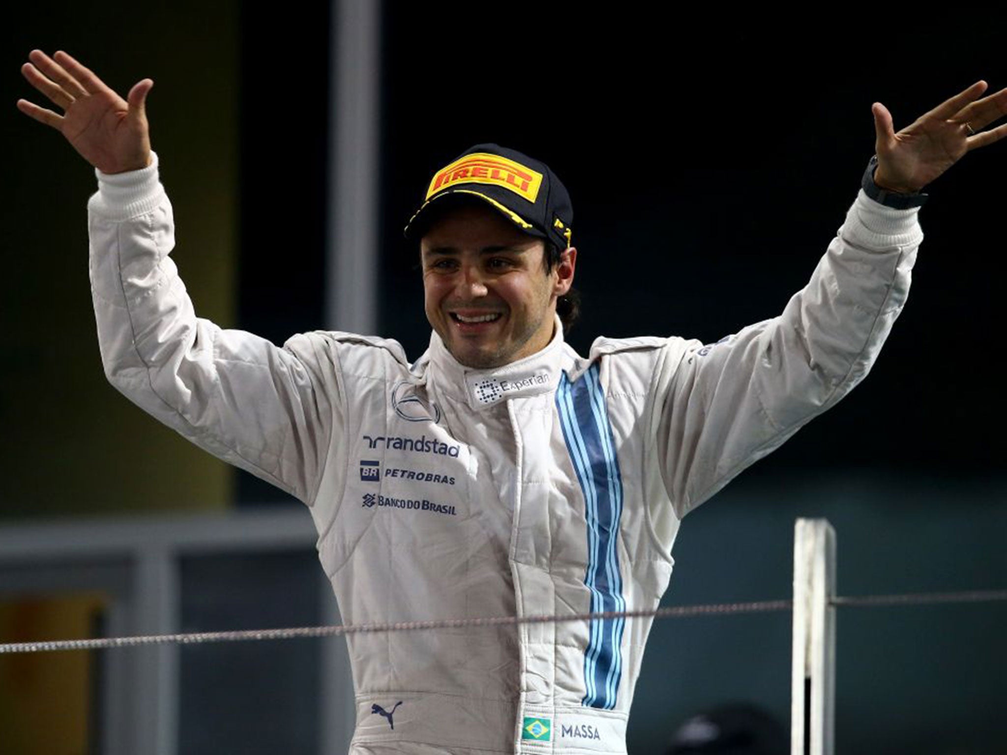 Felipe Massa of Brazil and Williams celebrates on the podium after finishing second