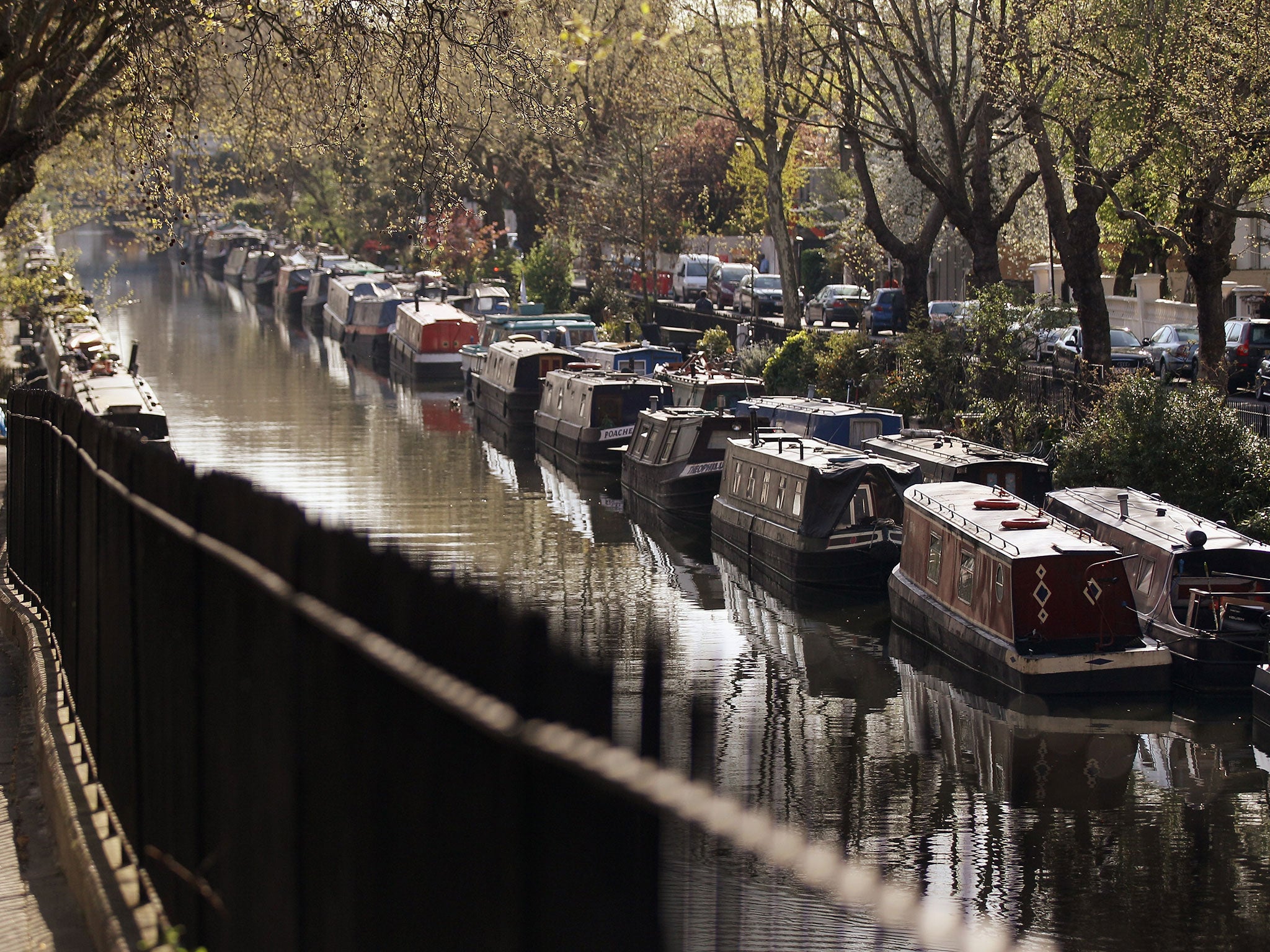 Narrow boats line the Regent's Canal in London, England