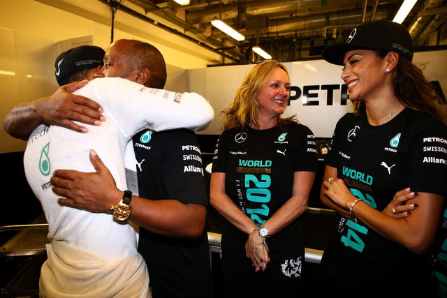 Lewis Hamilton embraces his father Anthony after winning the 2014 F1 title