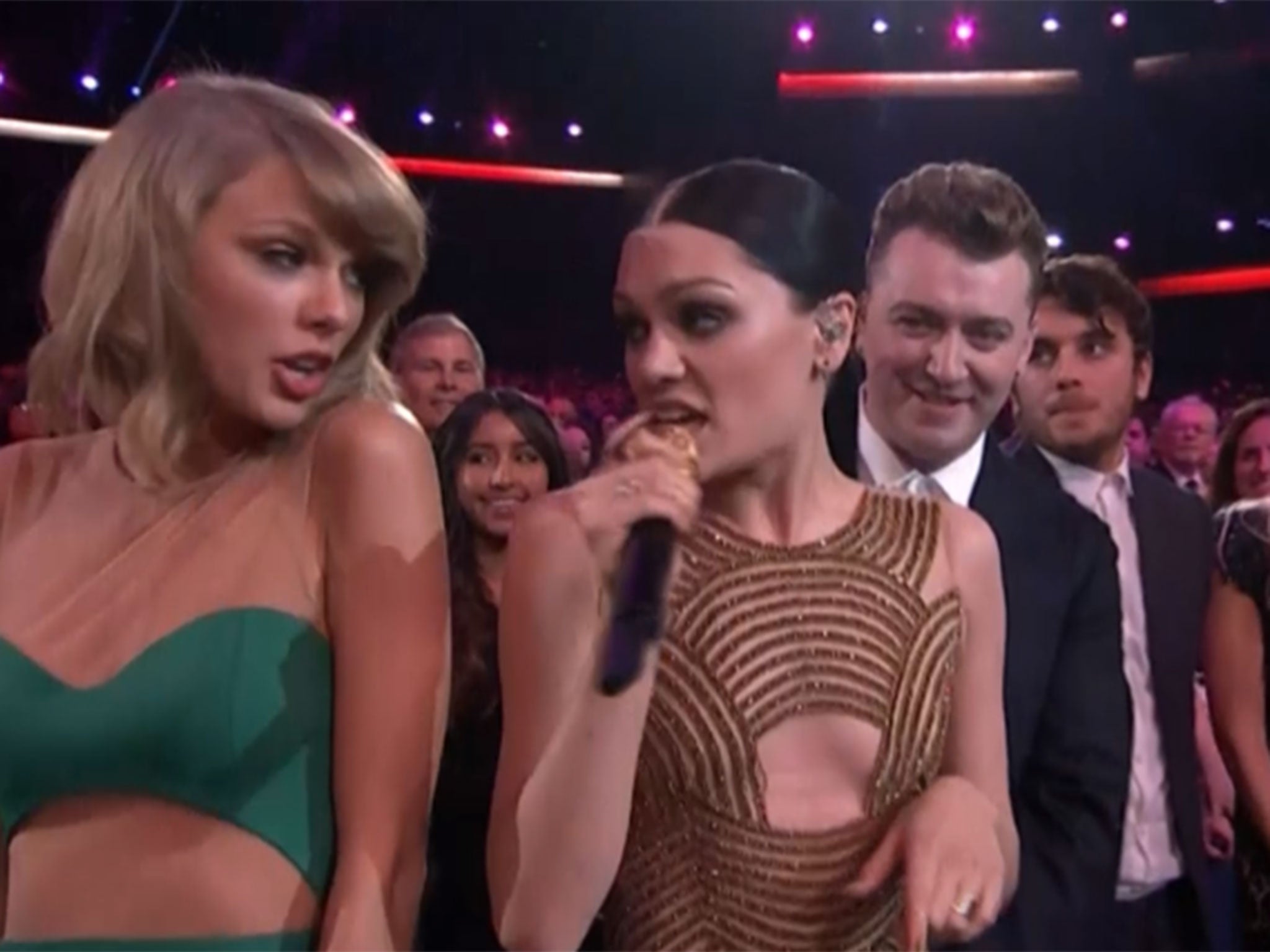 Taylor Swift dances with Sam Smith and Jessie J at the American Music Awards in Los Angeles.