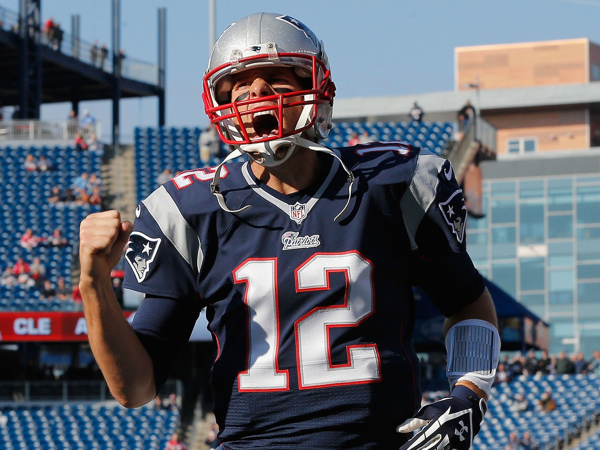 Tom Brady roars with delight as he leads the New England Patriots to a resounding win over the Detroit Lions