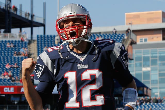 Tom Brady roars with delight as he leads the New England Patriots to a resounding win over the Detroit Lions
