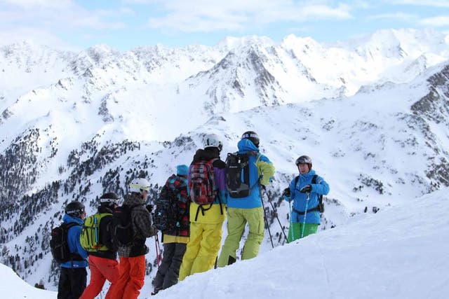 Head for the hills: Instructor Warren Smith gives students at his ski school a pep talk on the slopes