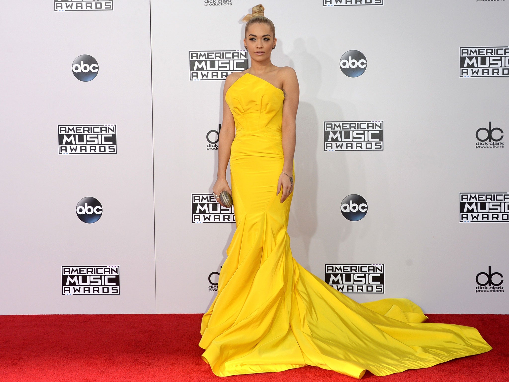 British pop star Rita Ora lighted the red carpet in her bright yellow Zac Posen number