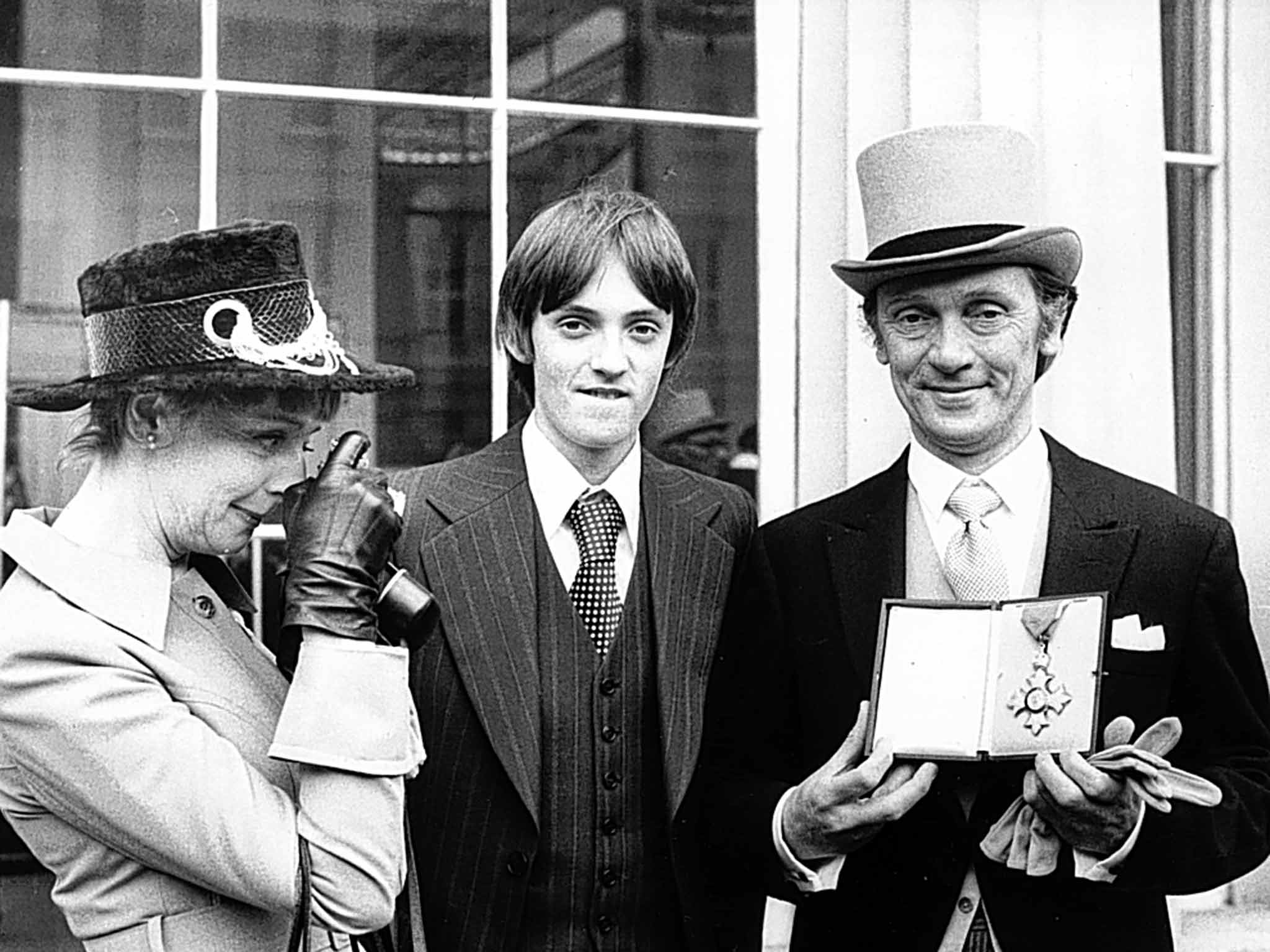 Pasco with his wife and son at Buckingham Palace in 1977 after receiving his CBE