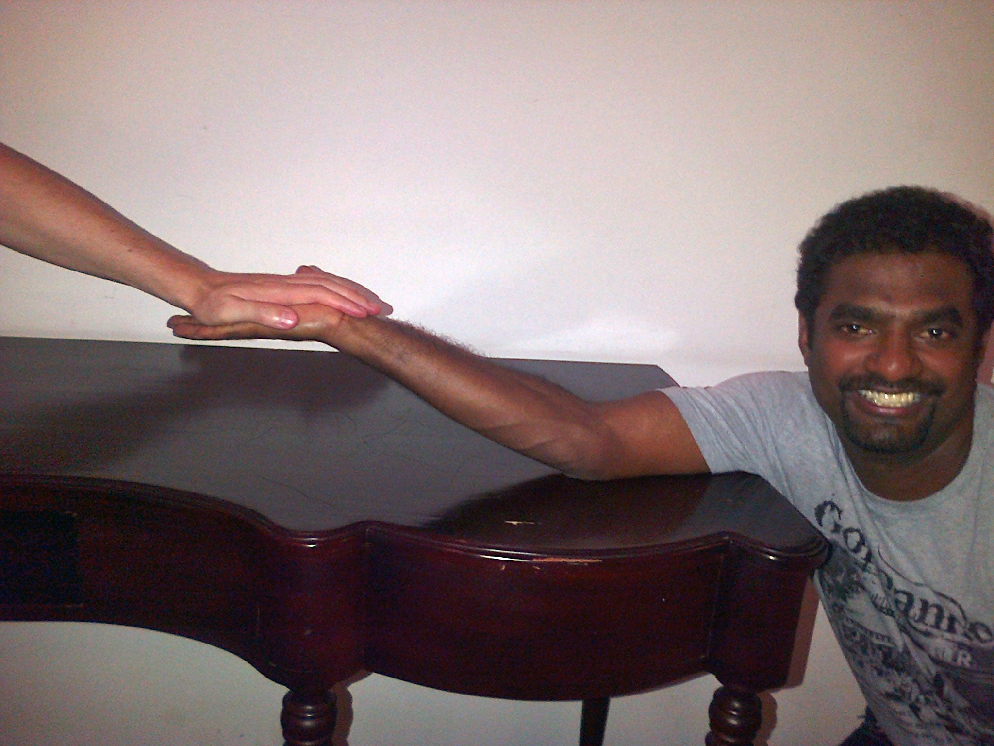 Murali proving his arm cannot be straightened