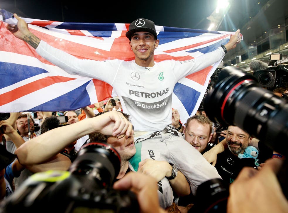 File photo of Lewis Hamilton celebrating becoming World Champion after victory in the 2014 Abu Dhabi Grand Prix as he was made favourite to become the first motor racing winner of Sports Personality of the Year since Damon Hill
